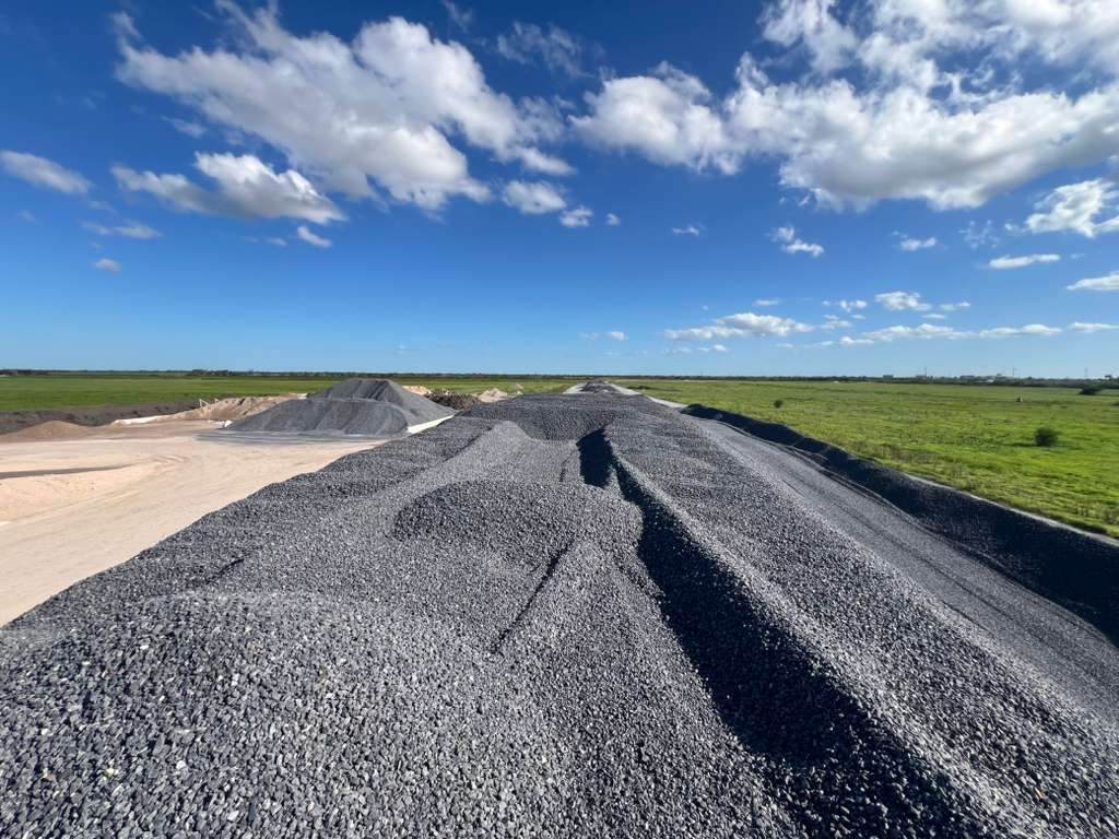Stockpile of dark gray crushed limestone and basalt aggregate
